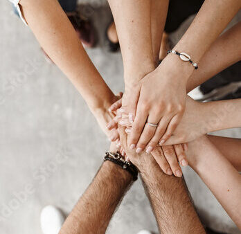 Teamwork, unity concept, group of friends put their hands together with copy space